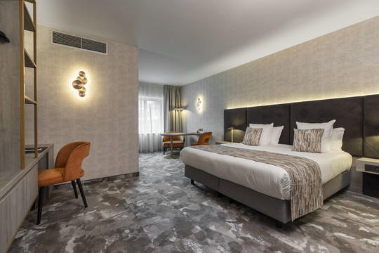 Chambre Deluxe avec lit king size confortable à l’hôtel Van der Valk Waterloo